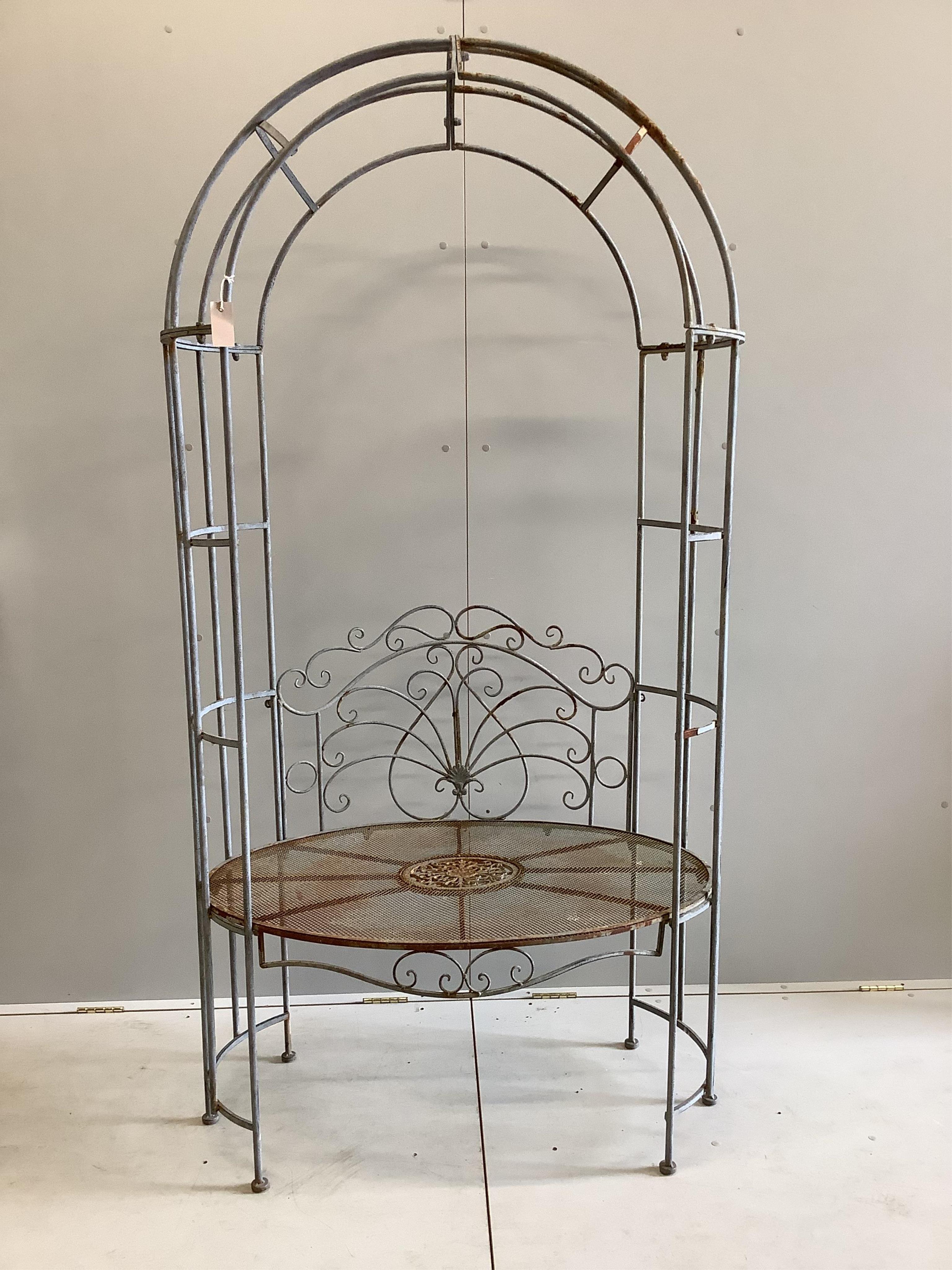 A metal garden arbour seat, width 105cm, depth 64cm, height 194cm. Condition - fair